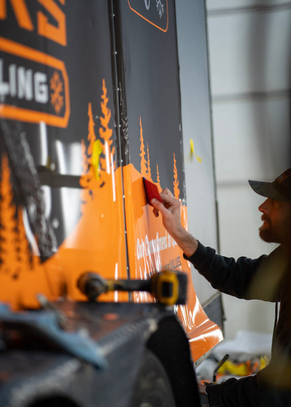 a man wrapping a truck by Wrap Matrix